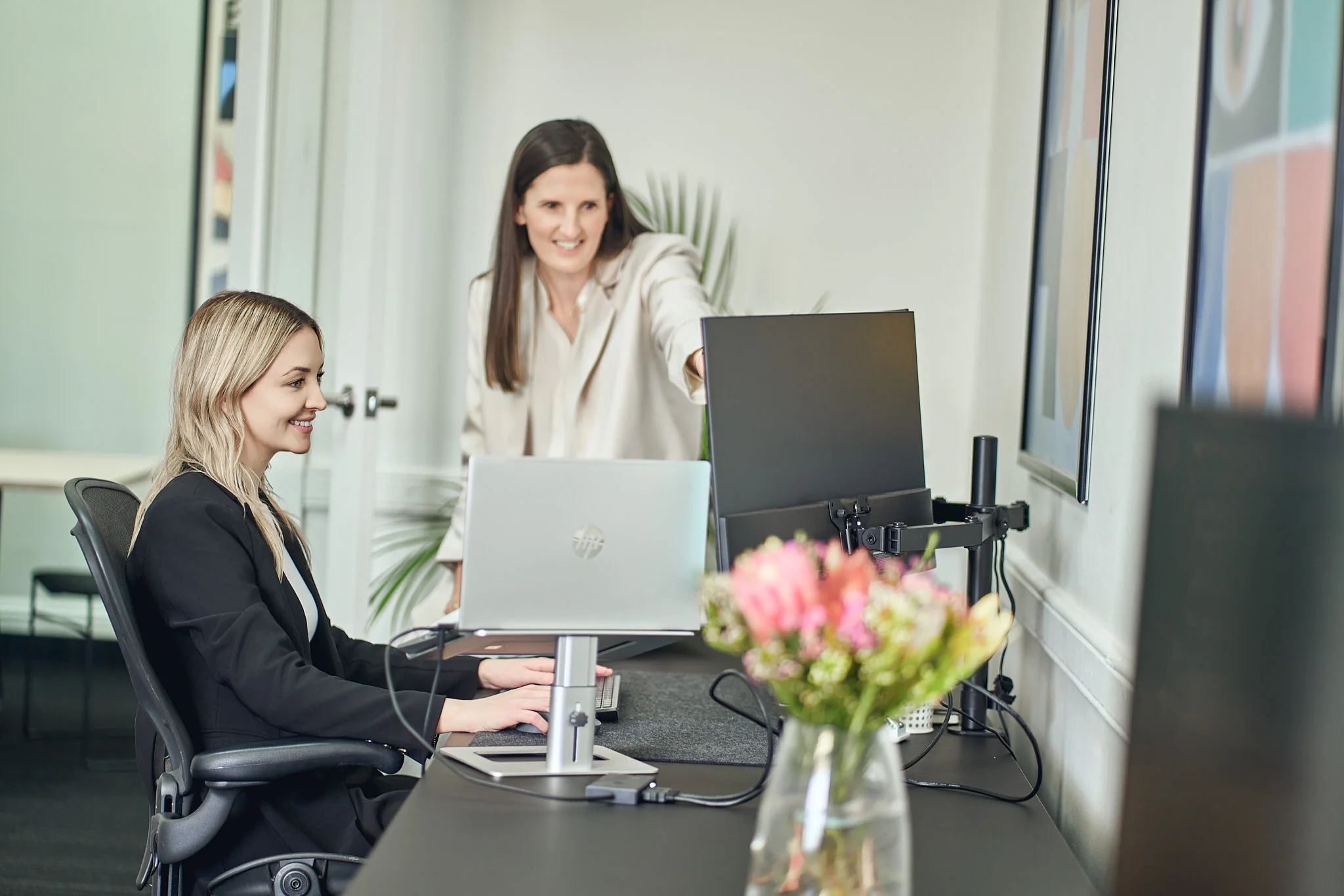 Cornerstone Consulting Group team members working together at a desk